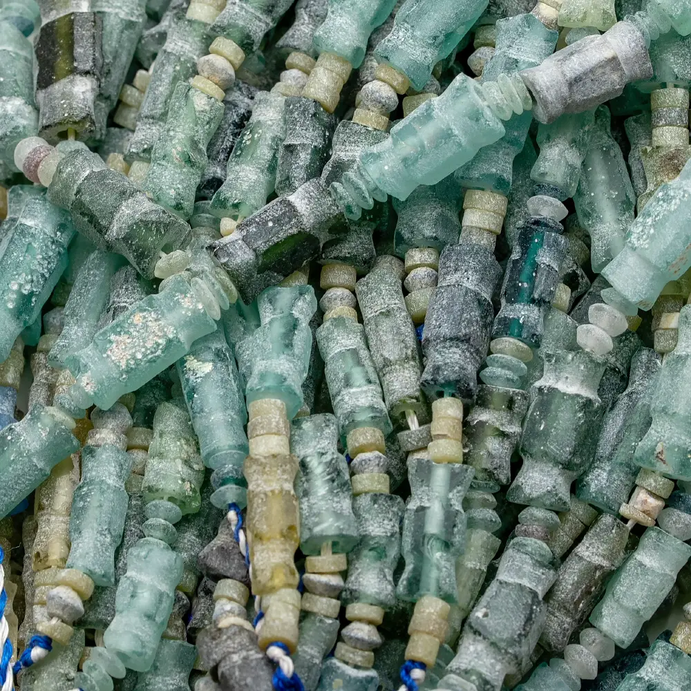 Antique Roman glass beads – carved