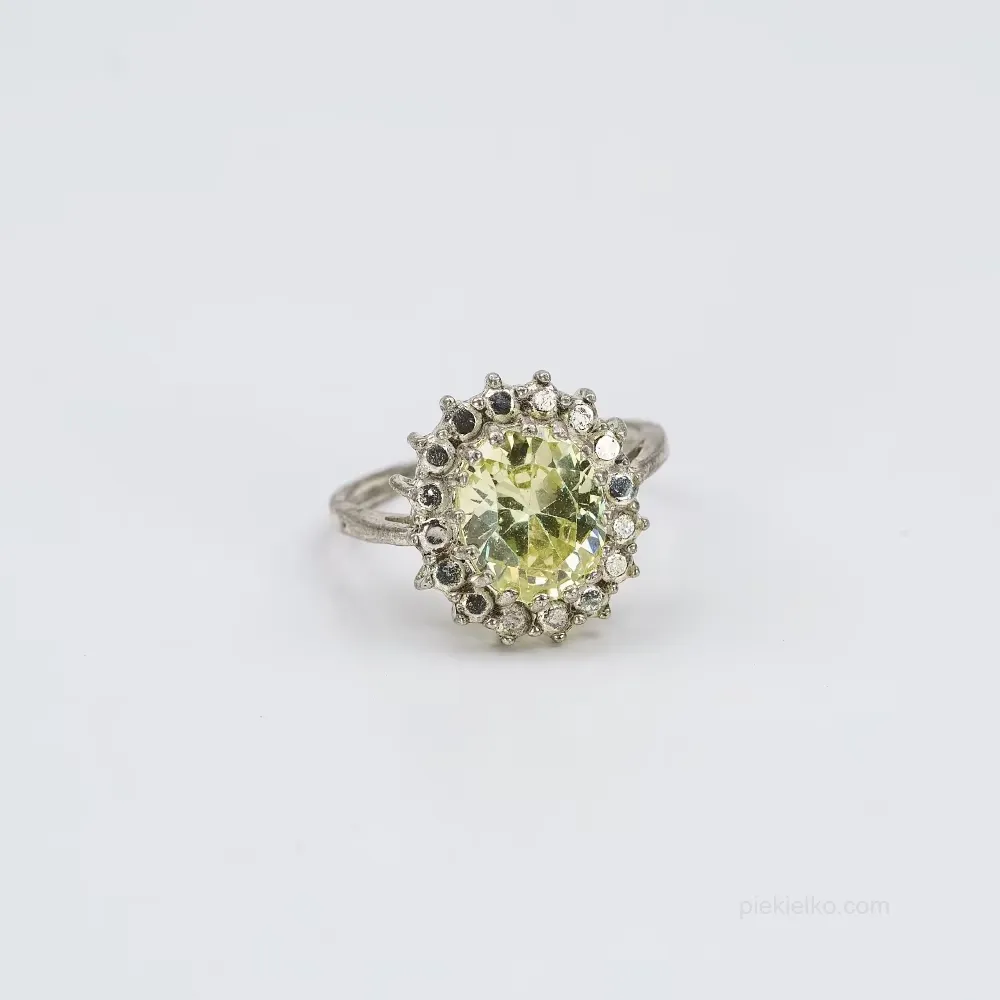 Silver ring with olive-hued stone