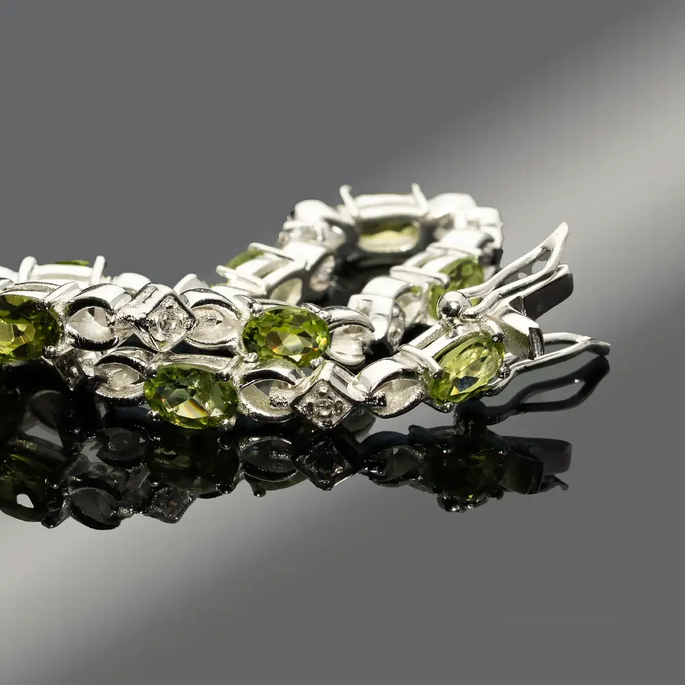 Silver bracelet with peridots and zircons &ndash; drops of green light